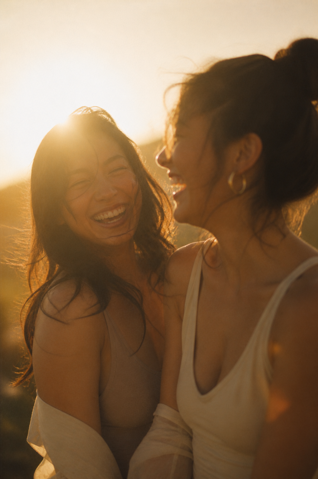 Women laughing at a fitness festival